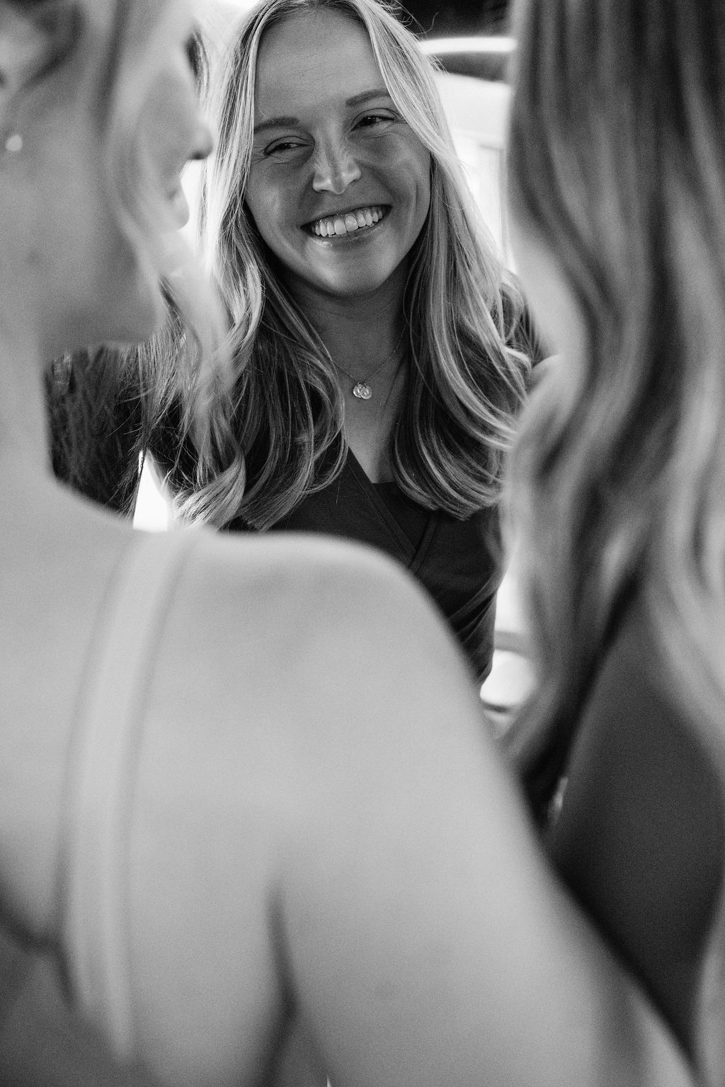 Two Core Collective members talking and smiling before a class