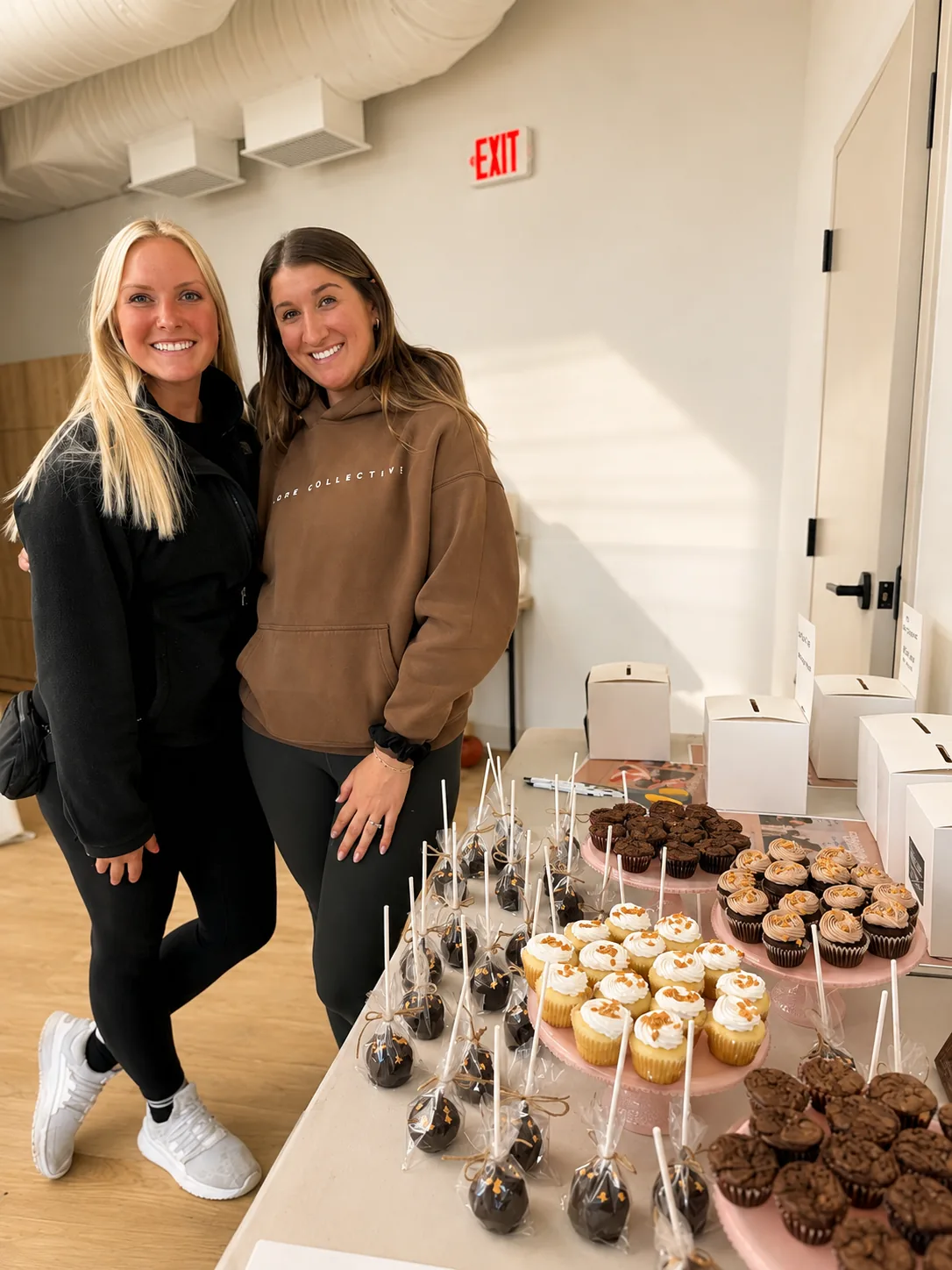 Members beside cupcakes and cake pops at a studio celebration