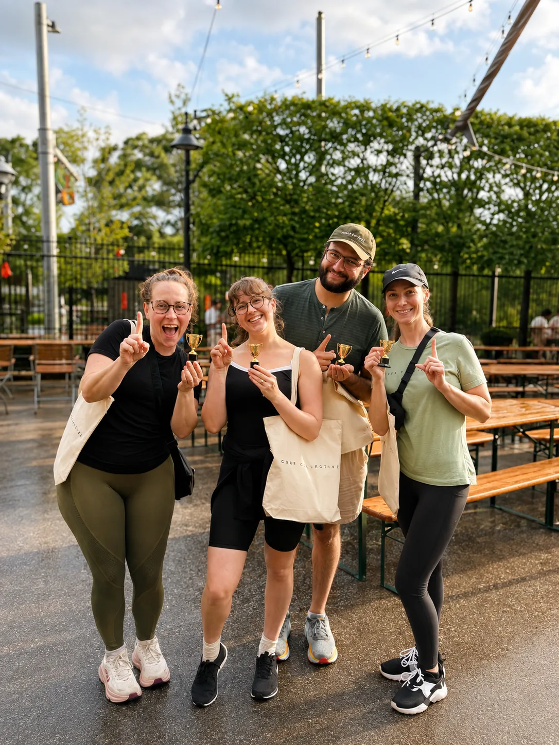 Members celebrating with trophies at an outdoor event